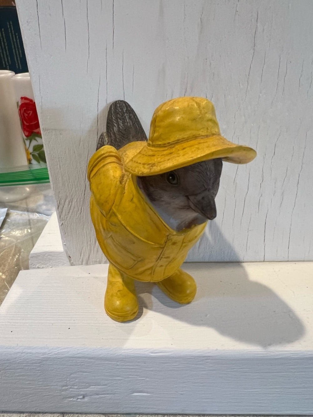 Cute yellow resin fisherman bird